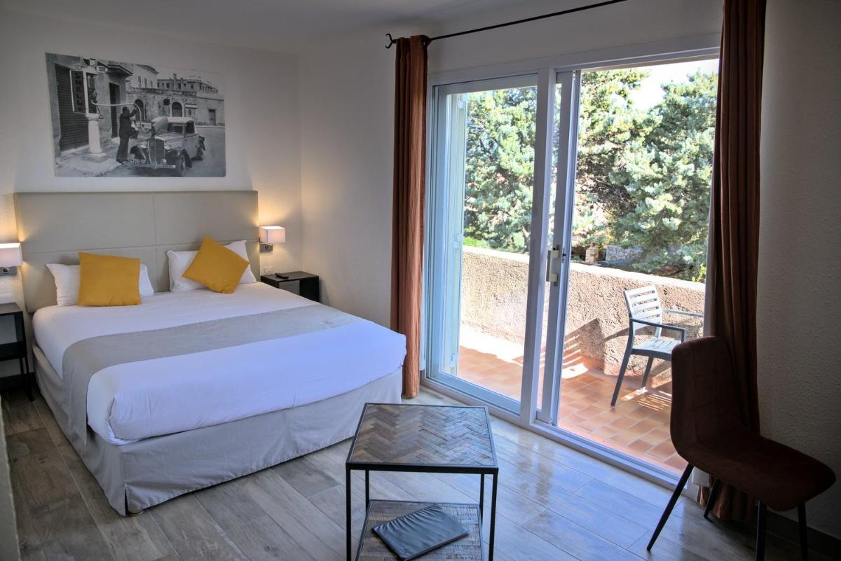 Un ou plusieurs lits dans un hébergement de l'établissement Hôtel Casa Rossa & Spa