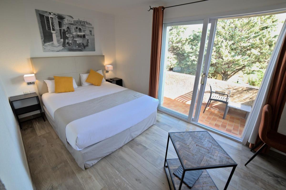 Un ou plusieurs lits dans un hébergement de l'établissement Hôtel Casa Rossa & Spa