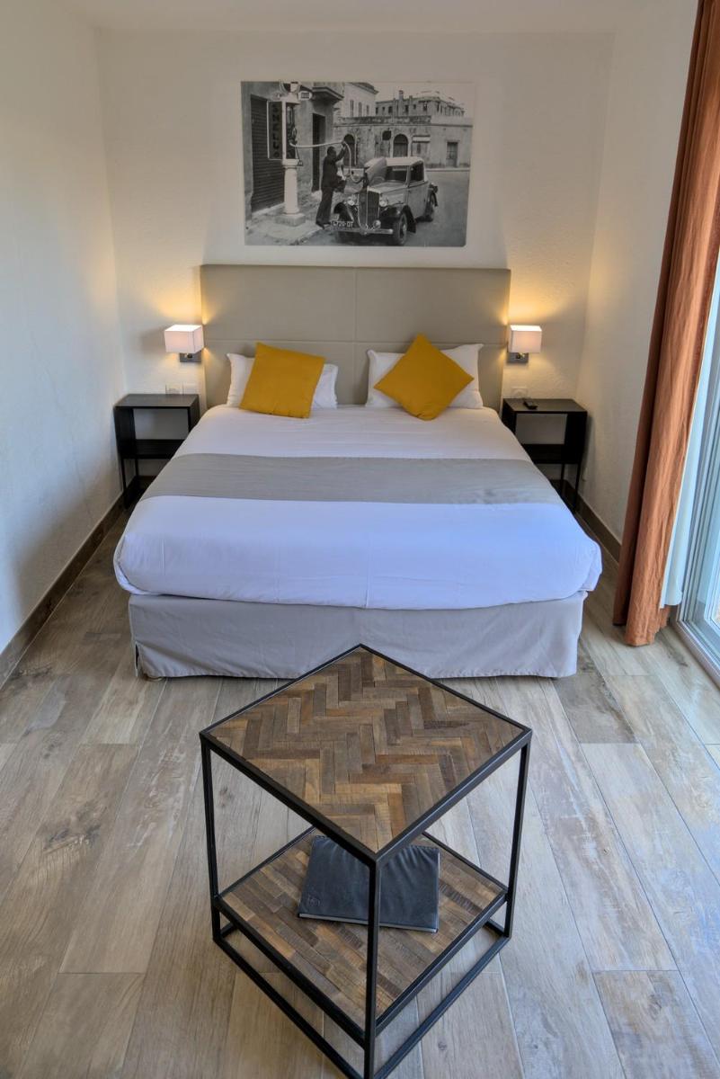 Un ou plusieurs lits dans un hébergement de l'établissement Hôtel Casa Rossa & Spa
