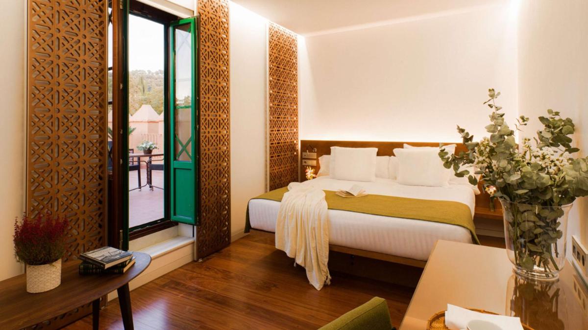 Cama o camas de una habitación en Alhambra Palace Hotel