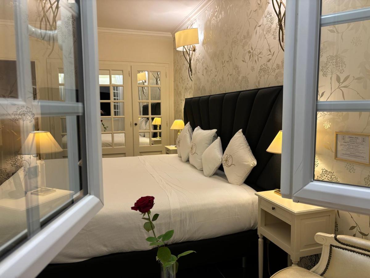 Un ou plusieurs lits dans un hébergement de l'établissement Auberge de Cassagne & Spa