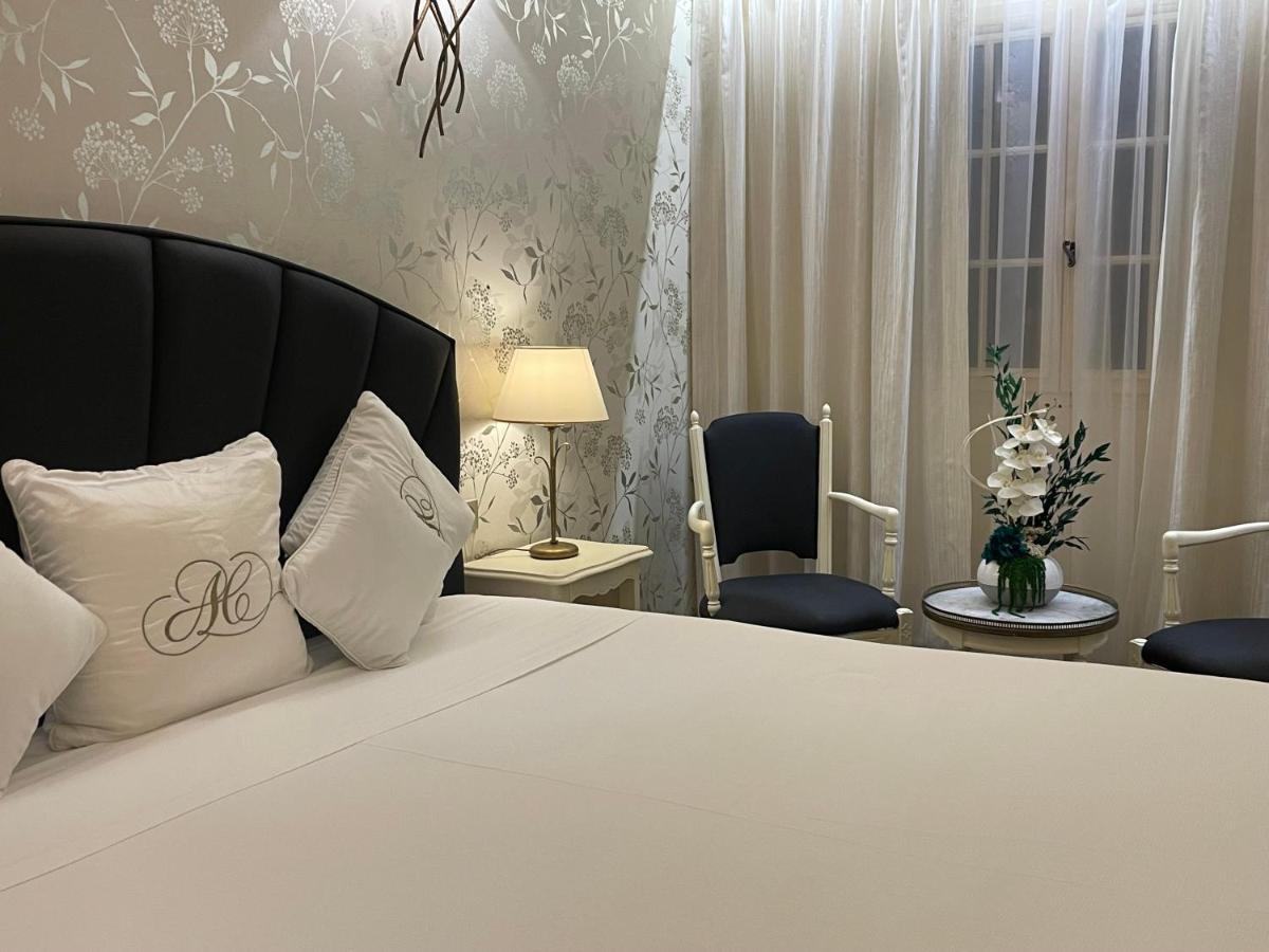 Un ou plusieurs lits dans un hébergement de l'établissement Auberge de Cassagne & Spa