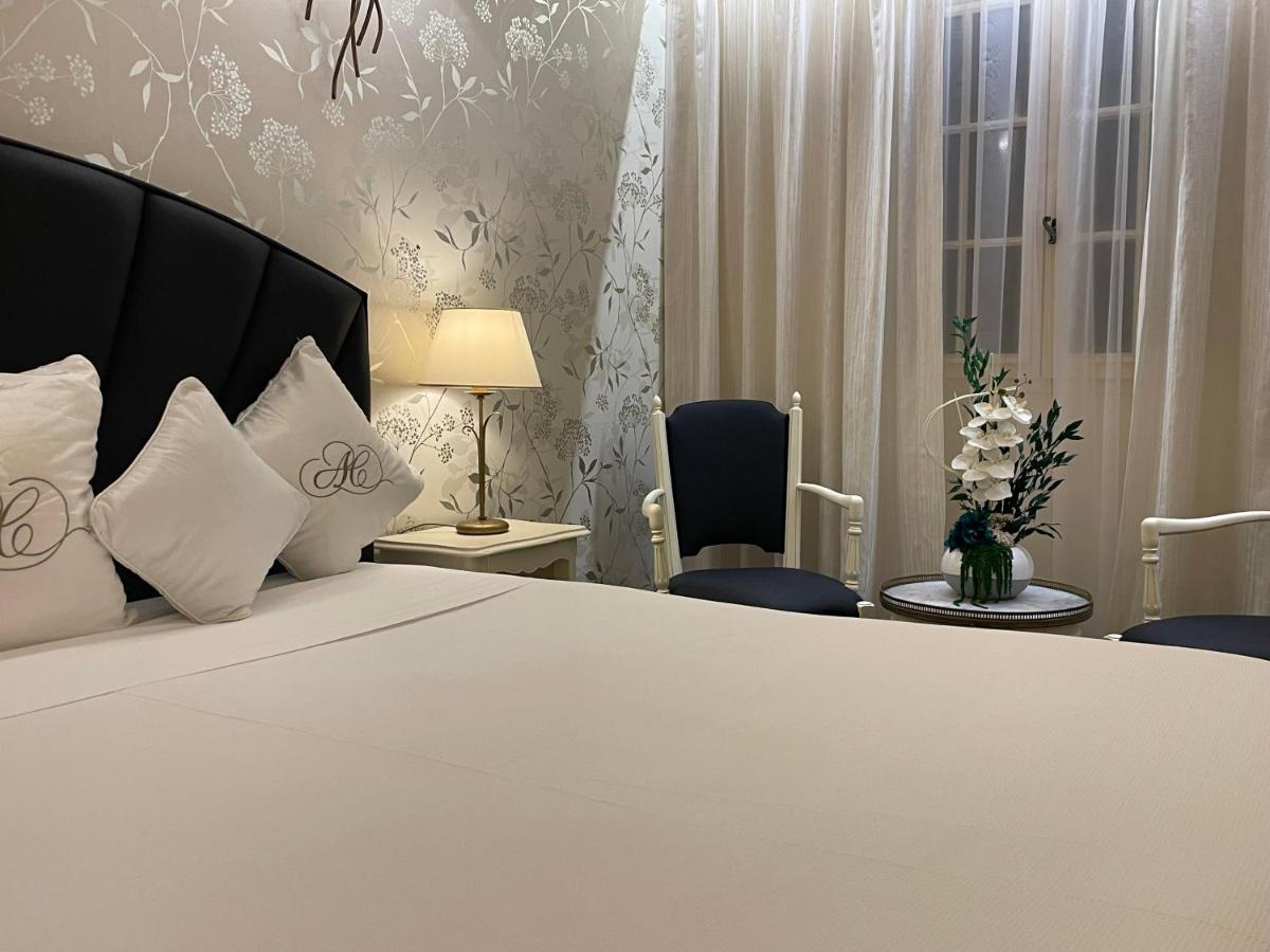Un ou plusieurs lits dans un hébergement de l'établissement Auberge de Cassagne & Spa