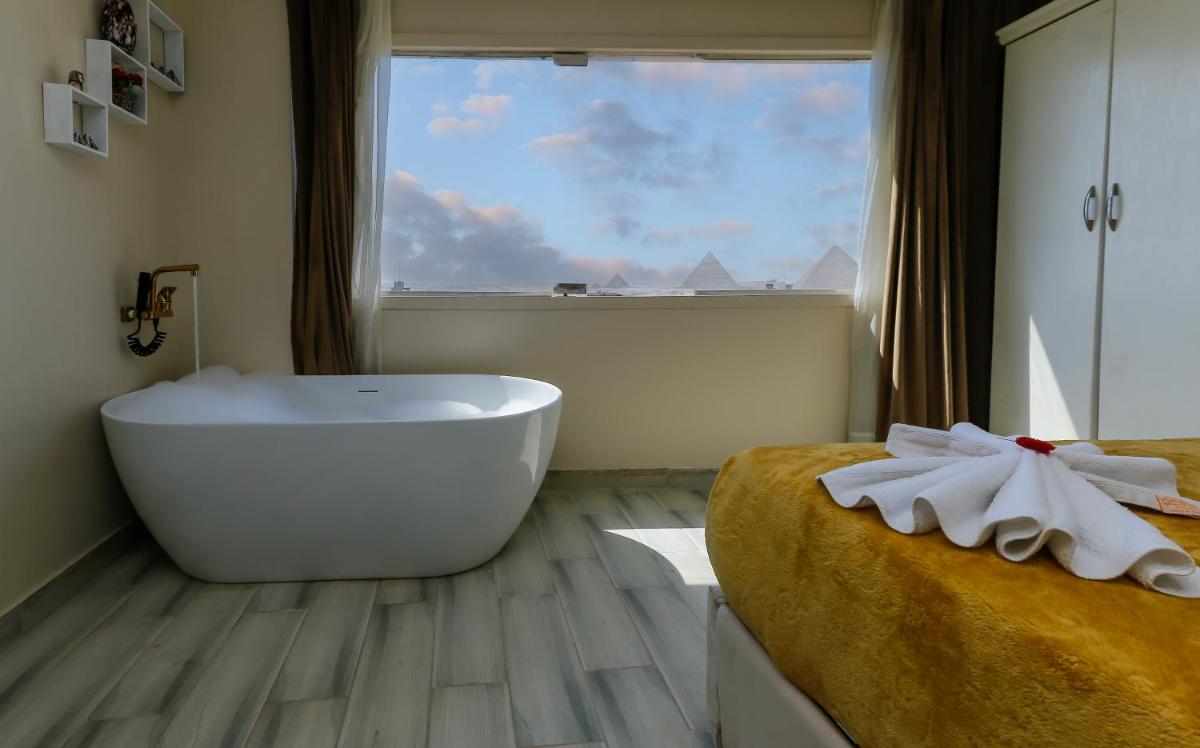 Venus Pyramids Inn - Top Roof Access W Free Break Fast - Housity