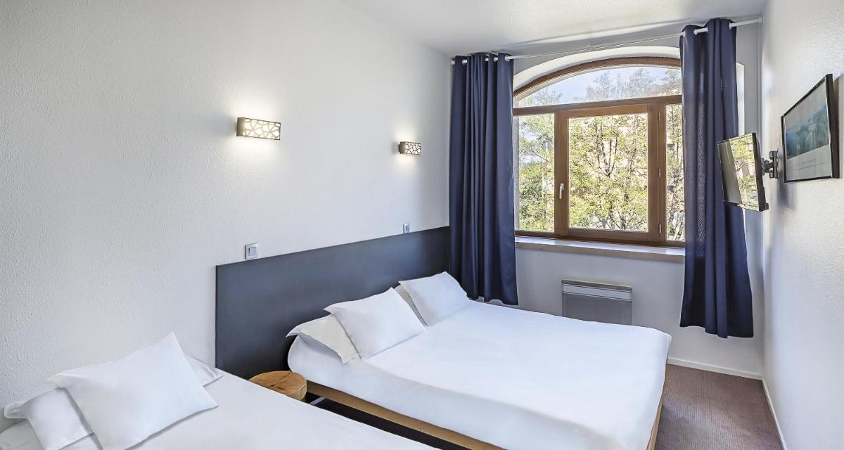 Un ou plusieurs lits dans un hébergement de l'établissement Sure Hotel by Best Western Annecy