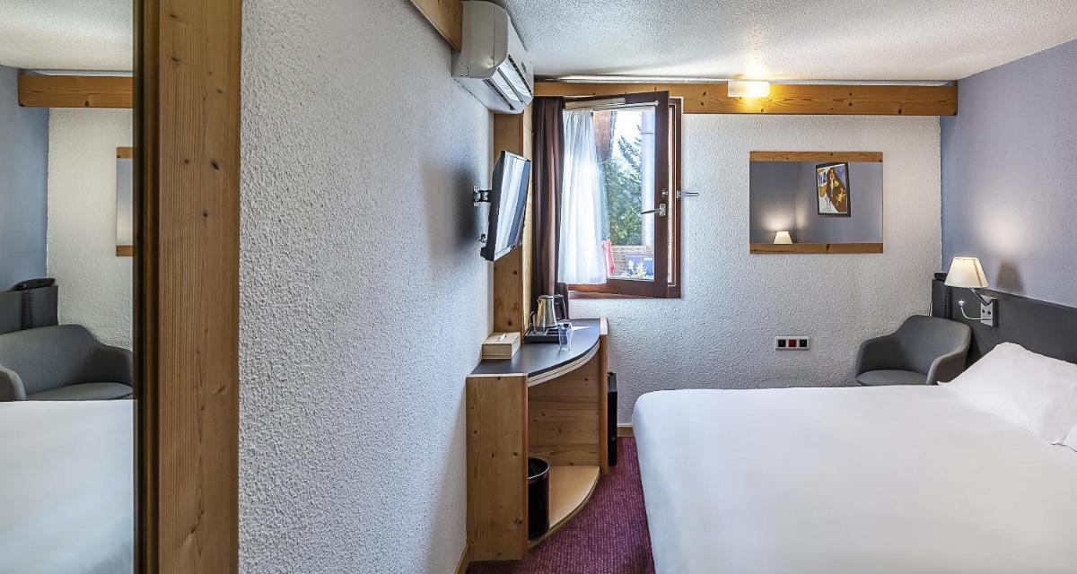 Un ou plusieurs lits dans un hébergement de l'établissement Sure Hotel by Best Western Annecy