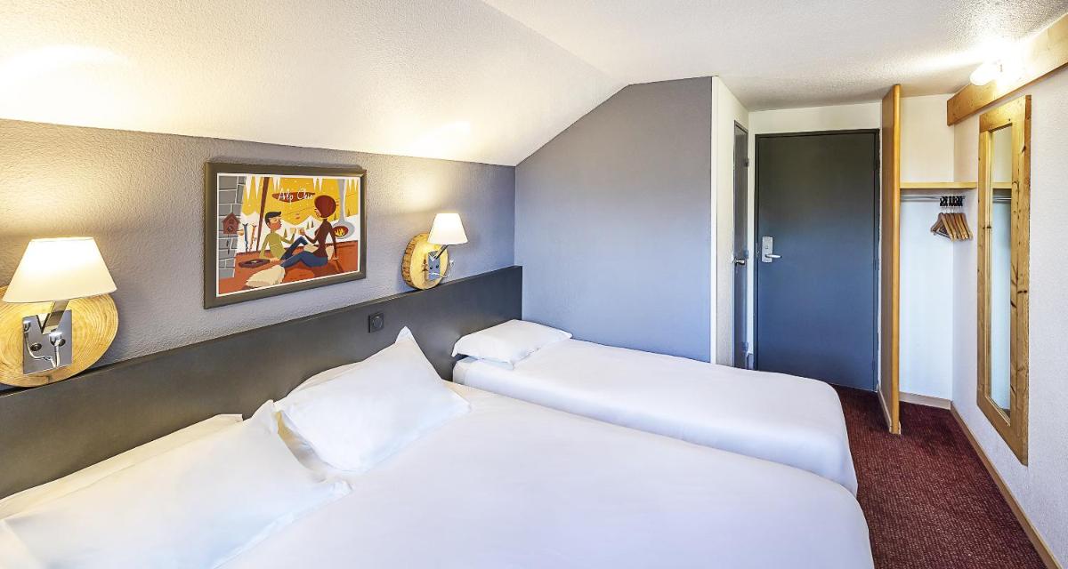 Un ou plusieurs lits dans un hébergement de l'établissement Sure Hotel by Best Western Annecy
