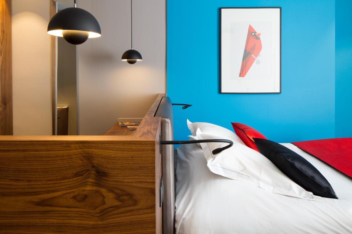Un ou plusieurs lits dans un hébergement de l'établissement Chapeau Rouge par William Frachot - Hôtel Espace Bien-être & Restaurant étoilé