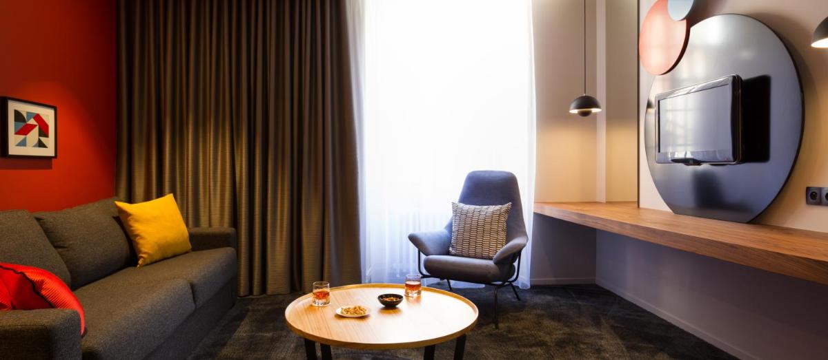 Coin salon dans l'établissement Chapeau Rouge par William Frachot - Hôtel Espace Bien-être & Restaurant étoilé