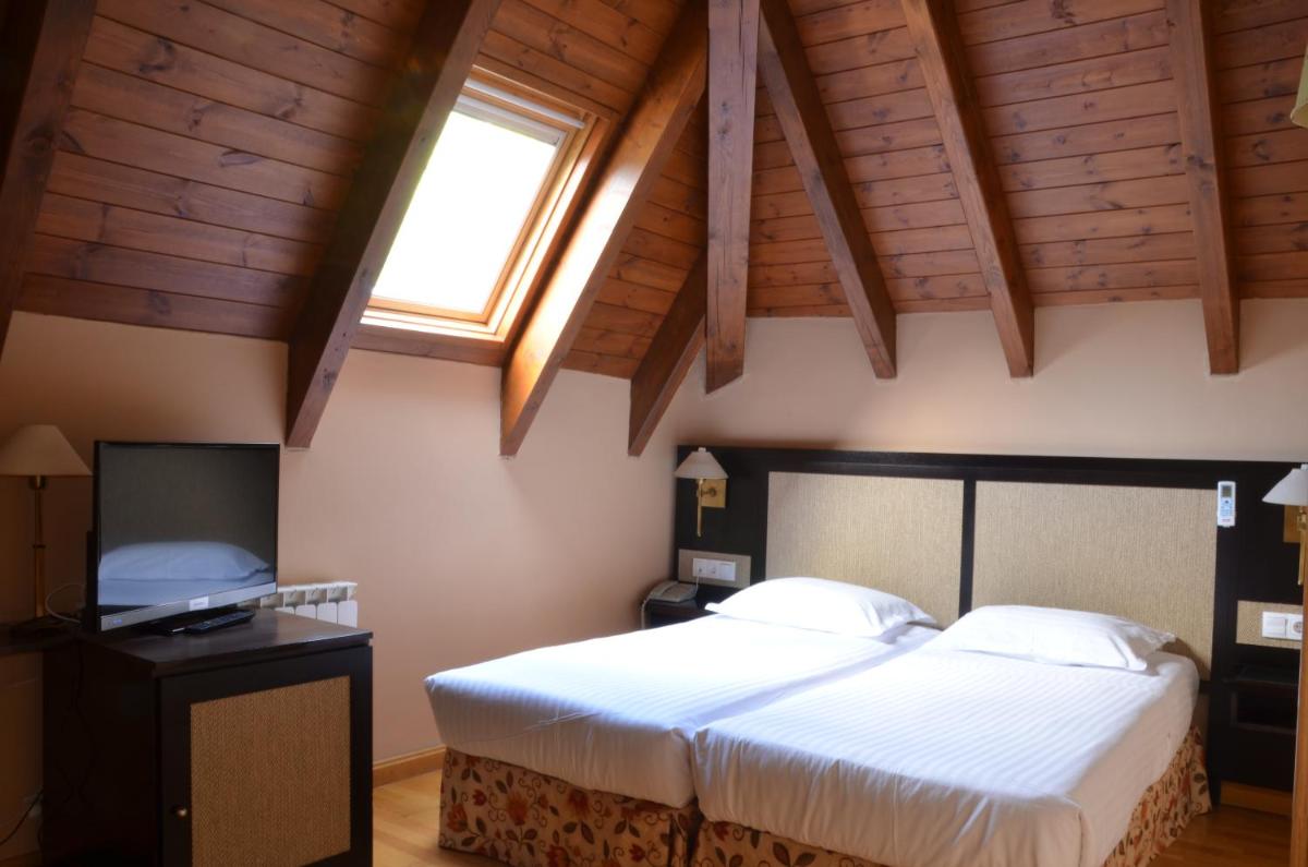 Cama o camas de una habitación en Hotel Spa Acevi Val d’Aran