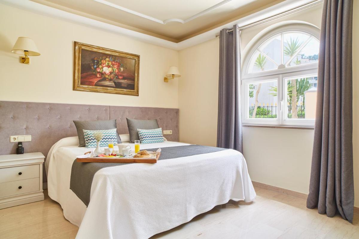 Cama o camas de una habitación en Grand Hotel Palladium Santa Eulalia del Río