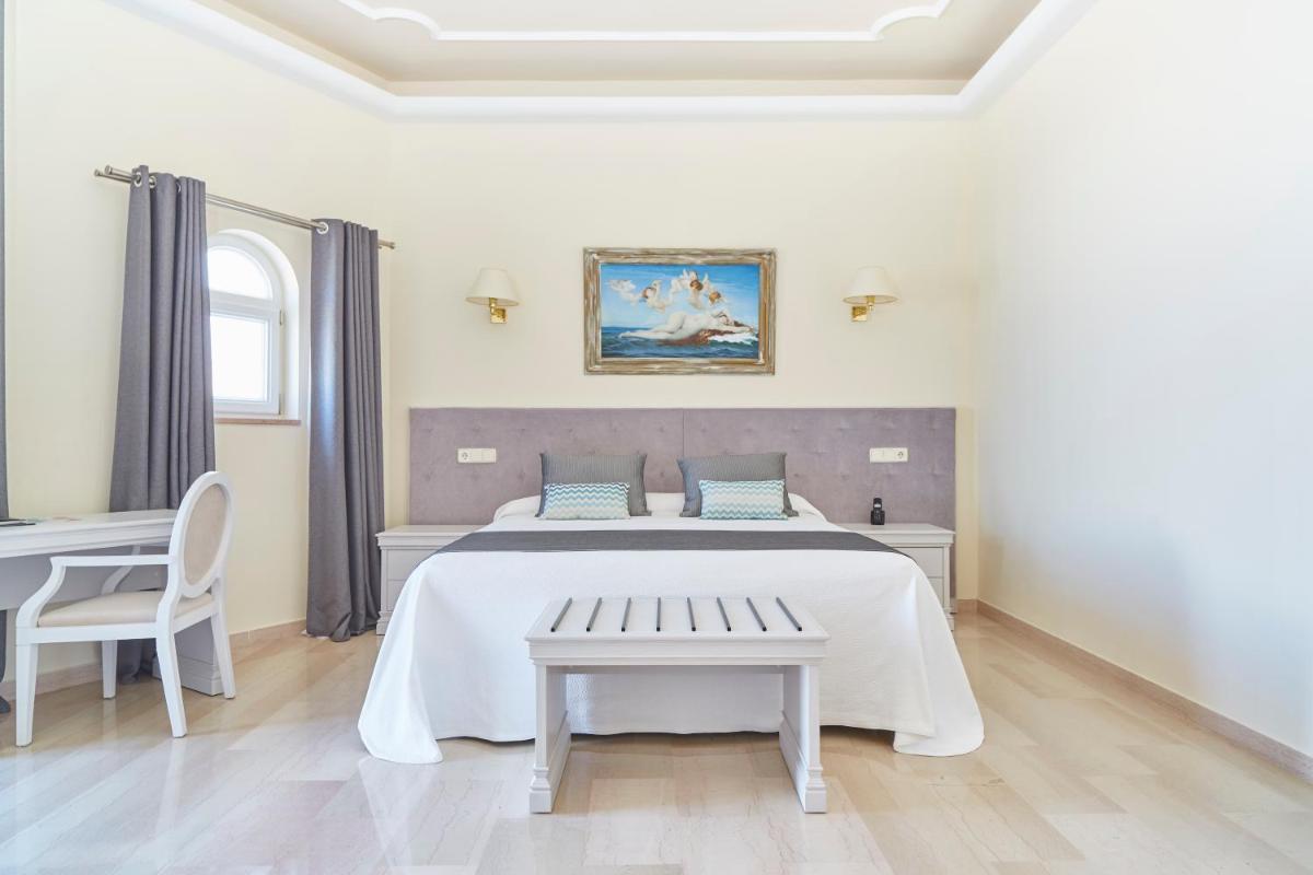 Cama o camas de una habitación en Grand Hotel Palladium Santa Eulalia del Río