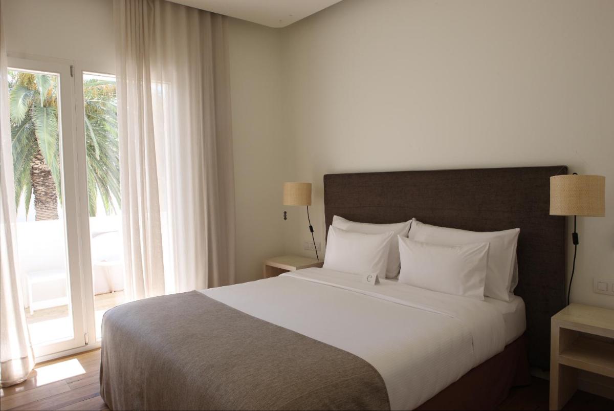 Cama o camas de una habitación en Hostal Empúries