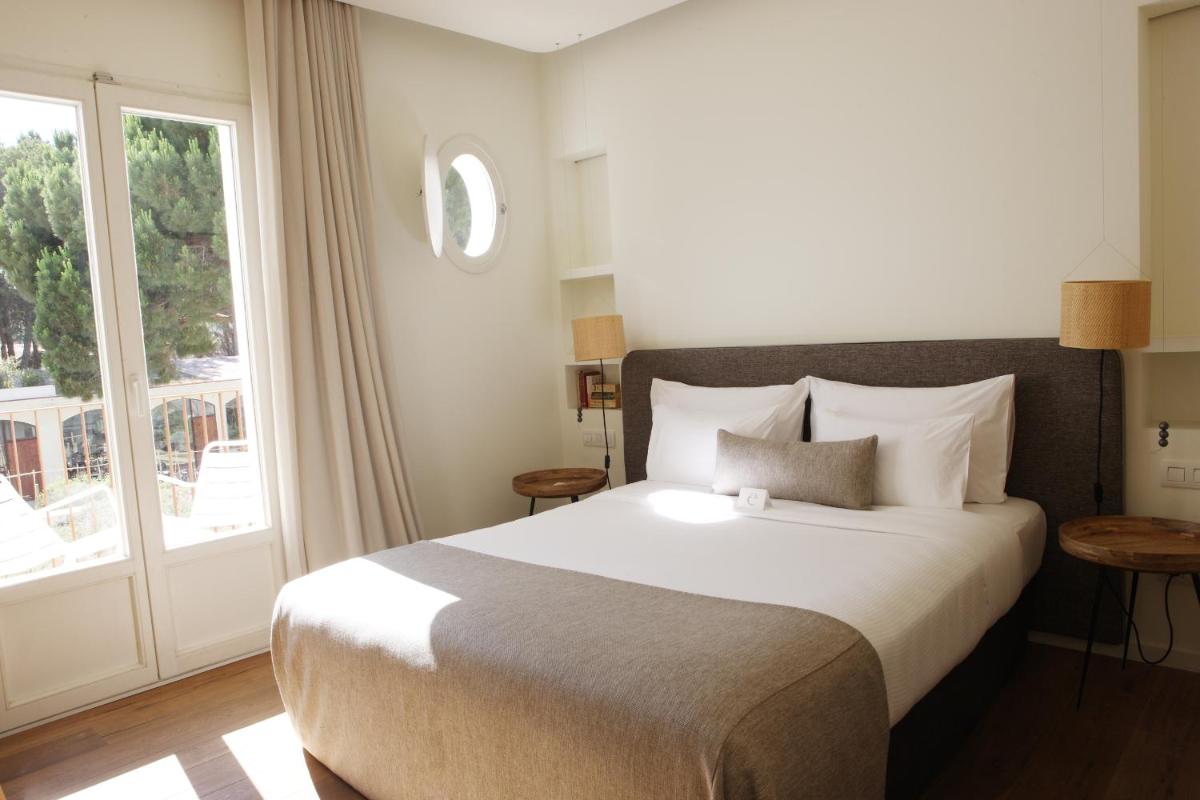Cama o camas de una habitación en Hostal Empúries