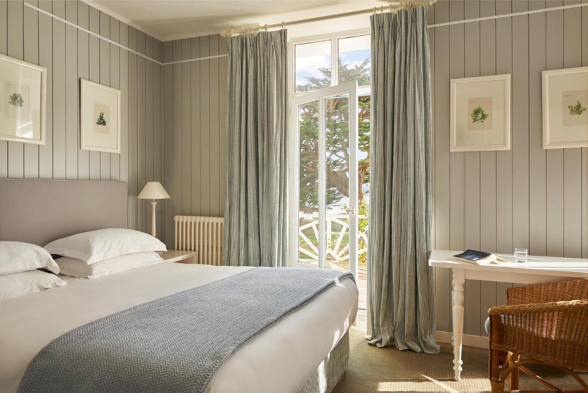 Un ou plusieurs lits dans un hébergement de l'établissement Le Grand Hotel des Bains & Spa - Bretagne