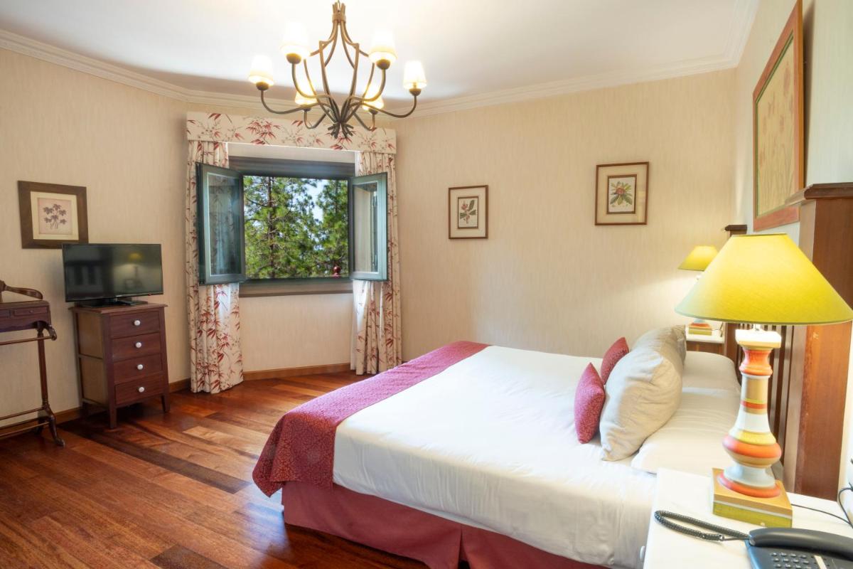Cama o camas de una habitación en Hotel Spa Villalba