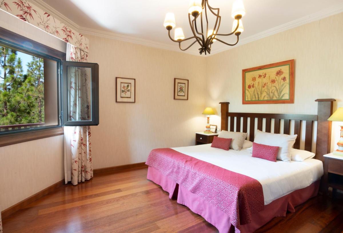 Cama o camas de una habitación en Hotel Spa Villalba