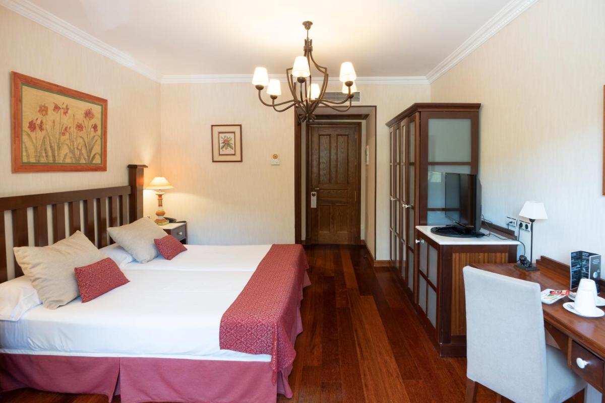 Cama o camas de una habitación en Hotel Spa Villalba