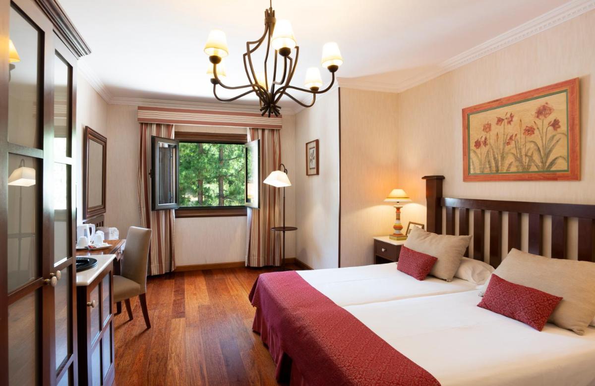Cama o camas de una habitación en Hotel Spa Villalba