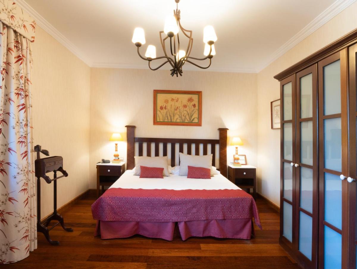Cama o camas de una habitación en Hotel Spa Villalba