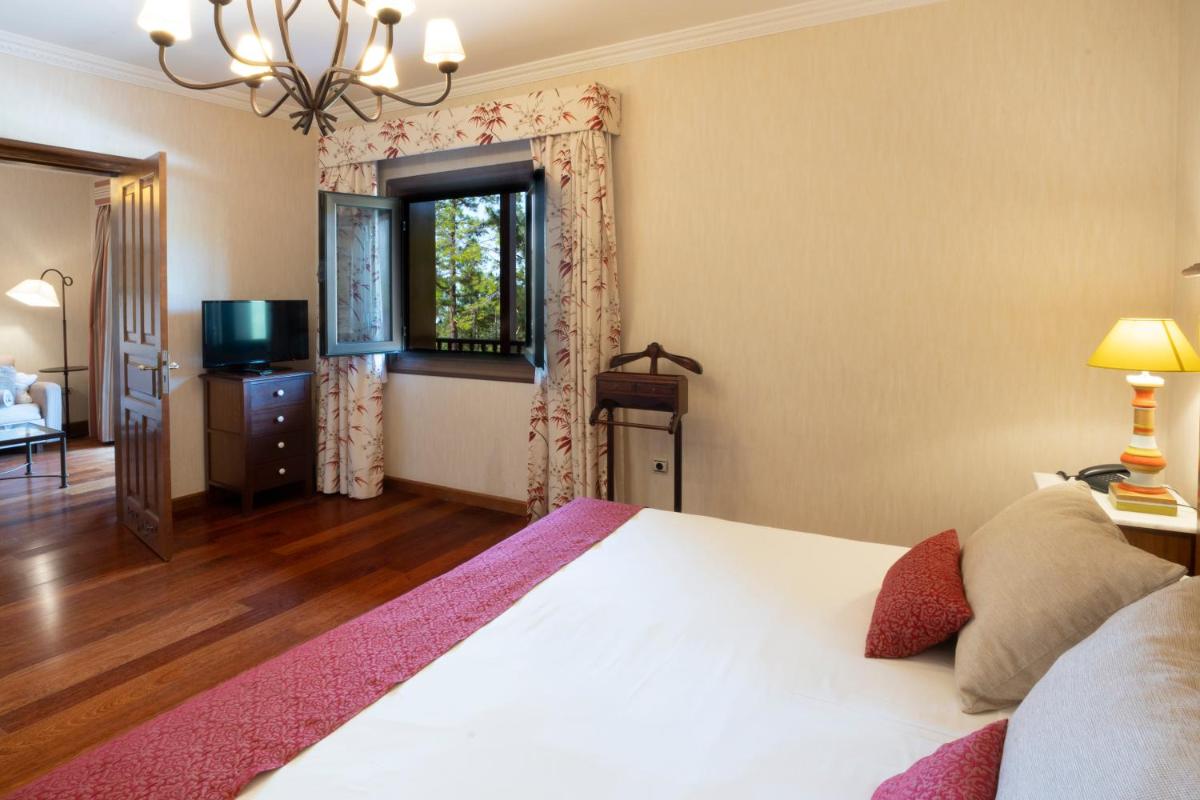 Cama o camas de una habitación en Hotel Spa Villalba