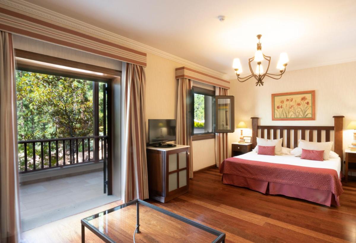 Cama o camas de una habitación en Hotel Spa Villalba
