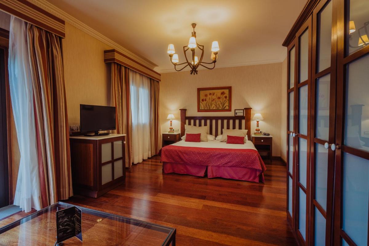 Cama o camas de una habitación en Hotel Spa Villalba