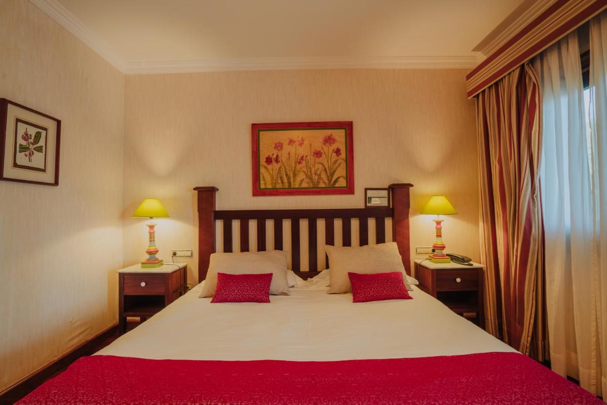 Cama o camas de una habitación en Hotel Spa Villalba