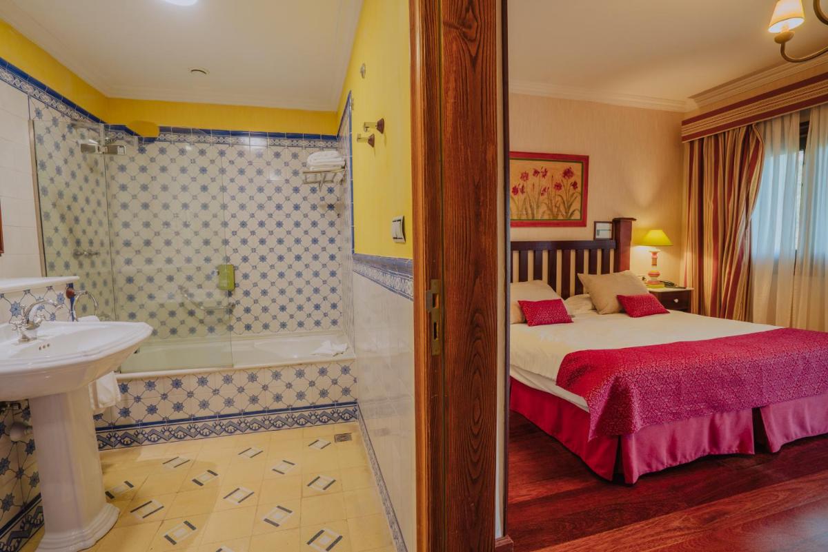 Cama o camas de una habitación en Hotel Spa Villalba