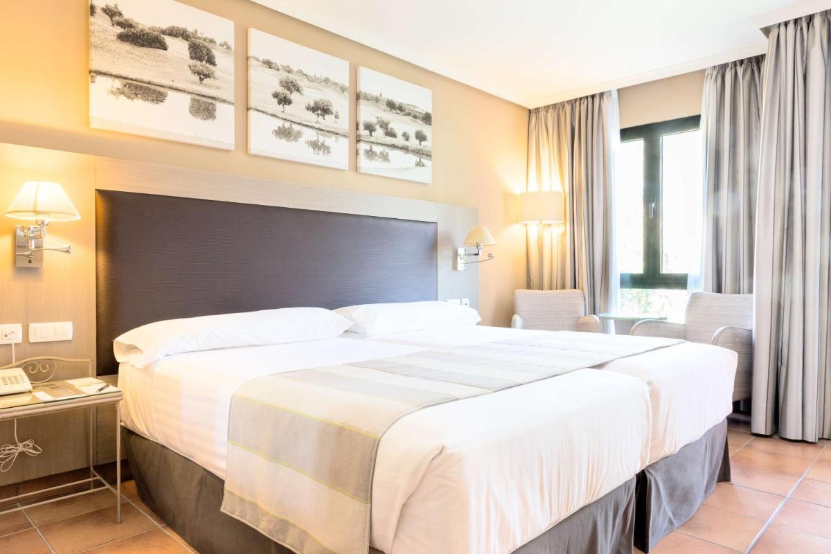 Cama o camas de una habitación en Barceló Jerez Montecastillo & Convention Center