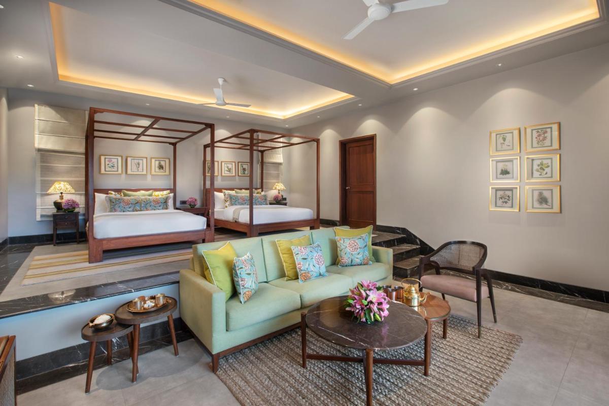 a living room with a couch and a bed at Anand Kashi by the Ganges Rishikesh - IHCL Seleqtions in Rishīkesh