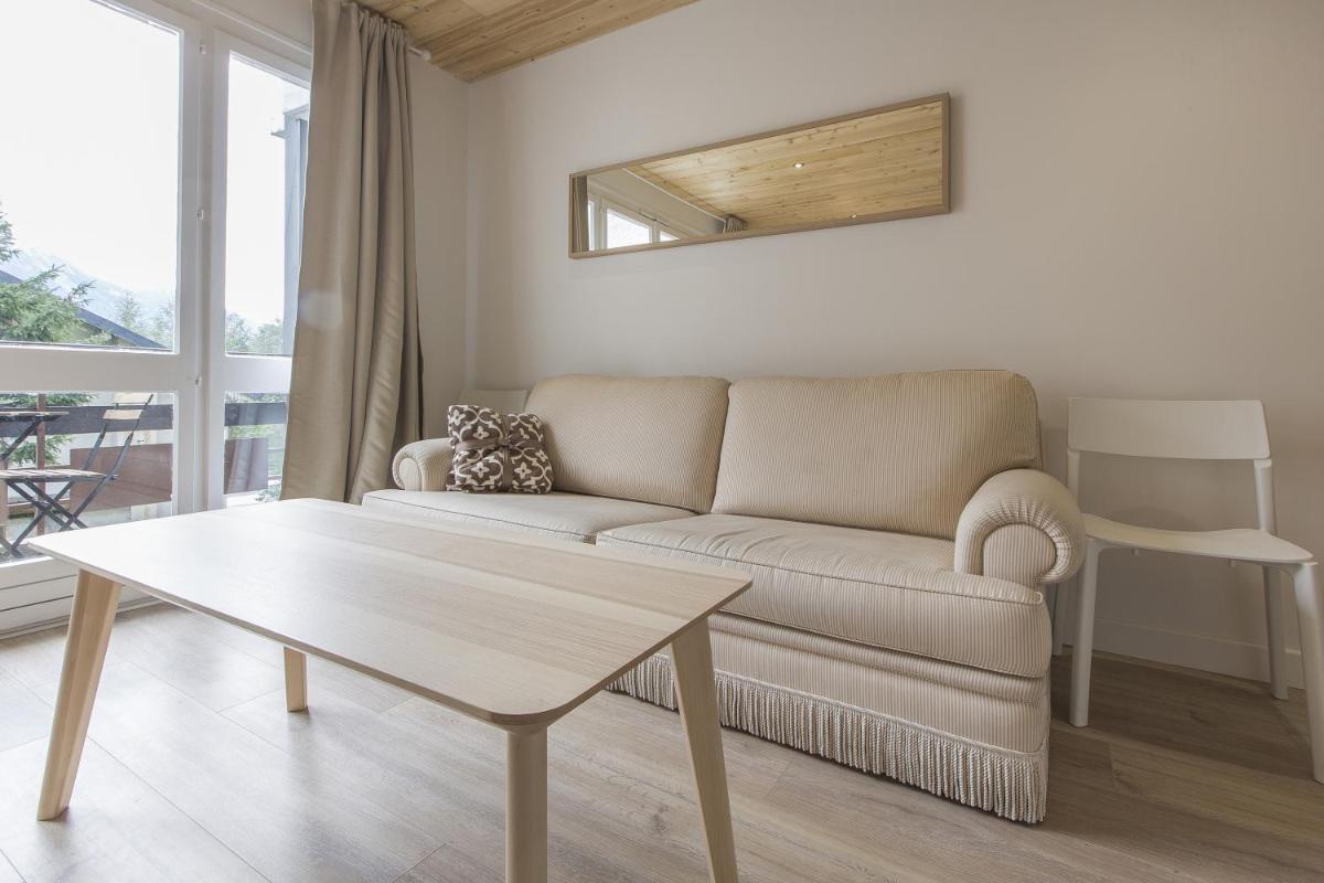 Coin salon dans l'établissement Résidence Le Domaine du Jardin Alpin - Courchevel 1850