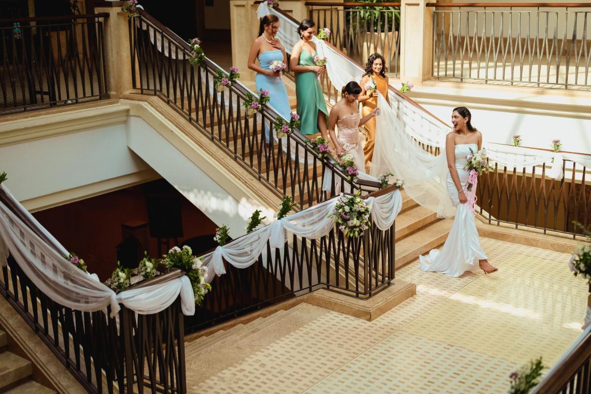 a bride and her bridal party walking down stairs at Grand Hyatt Goa in Panaji +80 photos a bride and her bridal party walking down stairs at Grand Hyatt Goa in Panaji +80 photos
