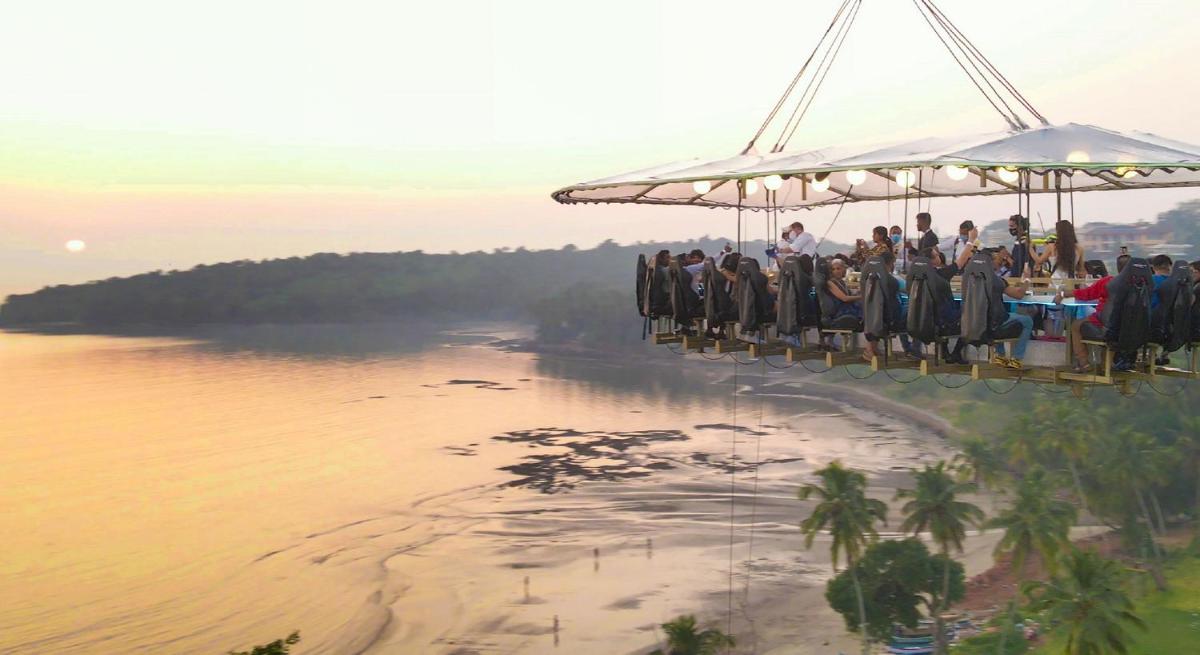 a group of people sitting on a ride over the water at Grand Hyatt Goa in Panaji a group of people sitting on a ride over the water at Grand Hyatt Goa in Panaji
