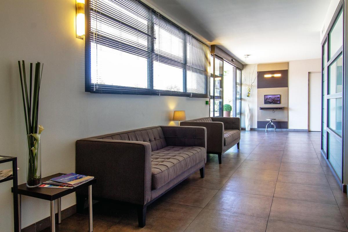 Coin salon dans l'établissement Forme-hotel & Spa Montpellier Sud-Est - Parc Expositions - Arena