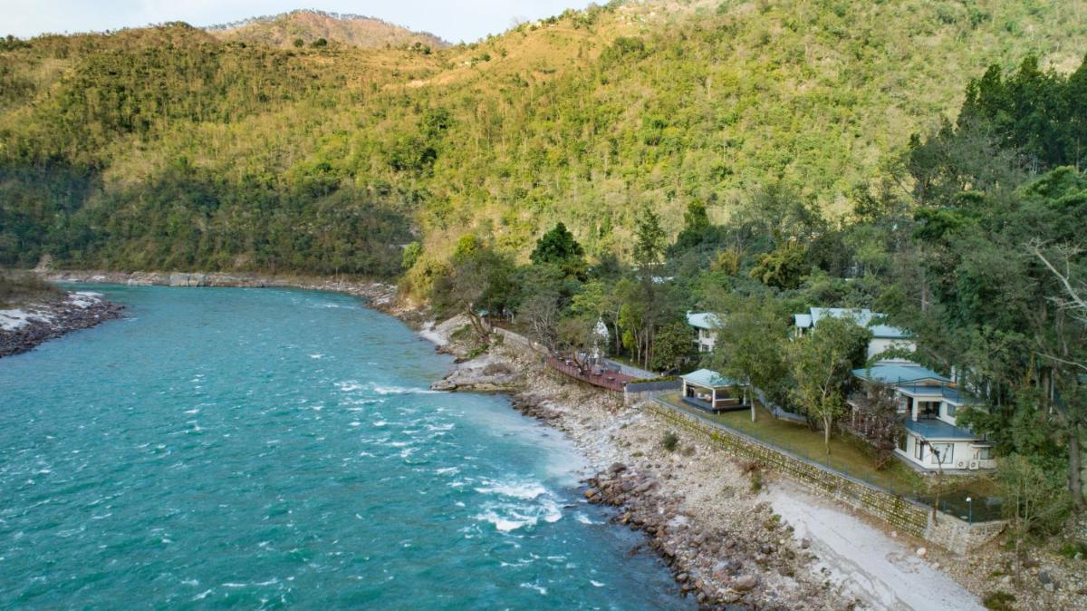 an aerial view of a house next to a river at Anand Kashi by the Ganges Rishikesh - IHCL Seleqtions in Rishīkesh