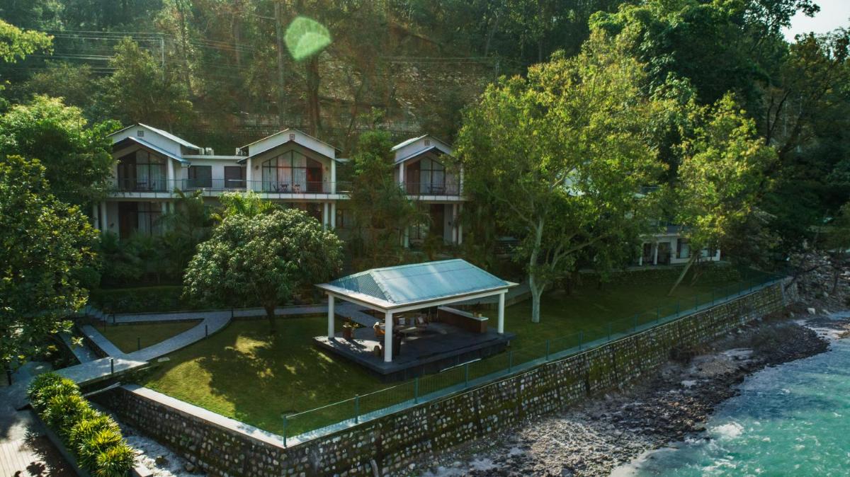 an aerial view of a house with a tennis court at Anand Kashi by the Ganges Rishikesh - IHCL Seleqtions in Rishīkesh