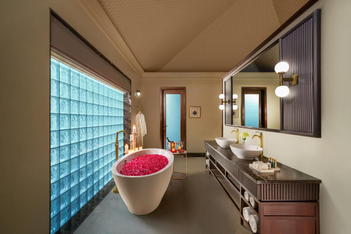a bathroom with two sinks and a large tub at Anand Kashi by the Ganges Rishikesh - IHCL Seleqtions in Rishīkesh