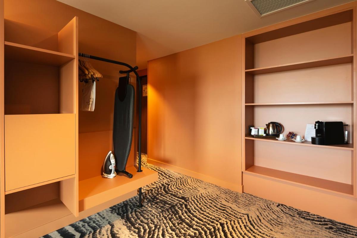 Un ou plusieurs lits dans un hébergement de l'établissement DoubleTree by Hilton Lyon Eurexpo & Spa