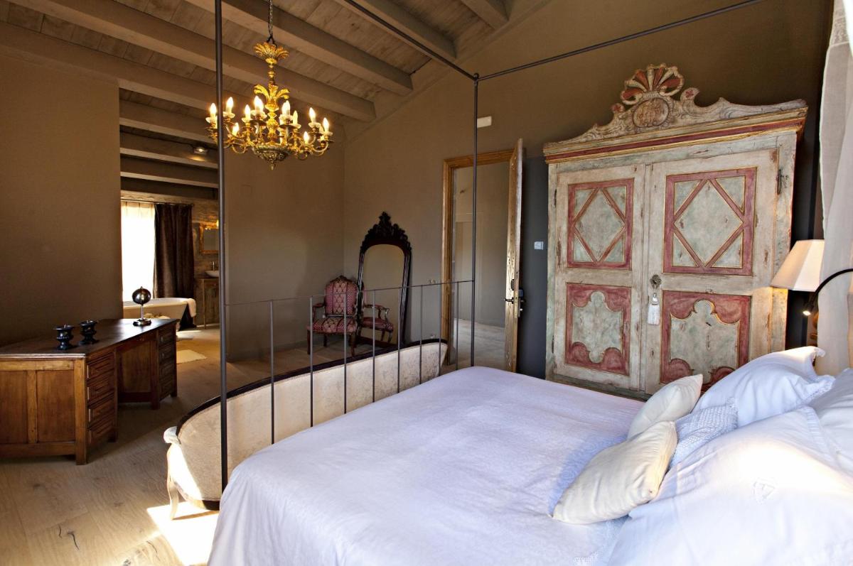 Cama o camas de una habitación en La Vella Farga Hotel