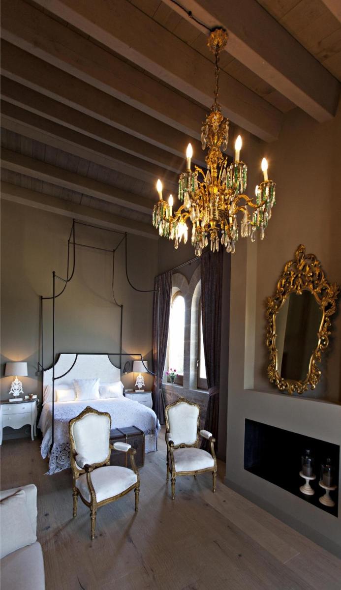Cama o camas de una habitación en La Vella Farga Hotel