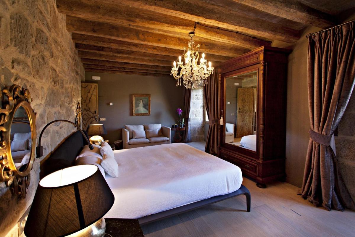 Cama o camas de una habitación en La Vella Farga Hotel