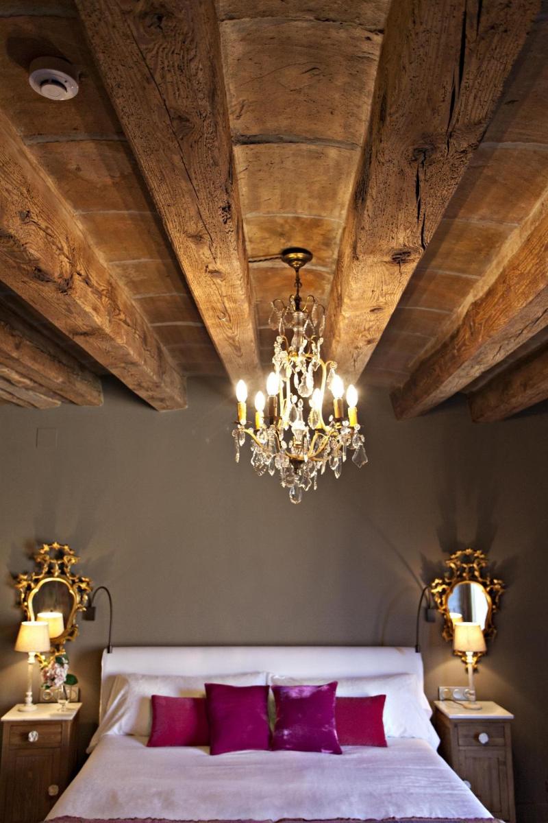 Cama o camas de una habitación en La Vella Farga Hotel