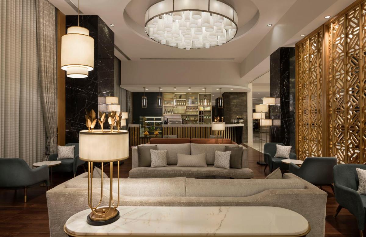 a living room with two couches and a table at InterContinental Jaipur Tonk Road by IHG in Jaipur