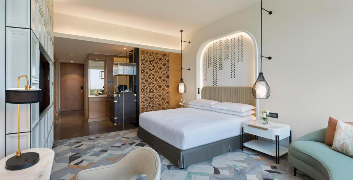 a hotel room with a bed and a couch at InterContinental Jaipur Tonk Road by IHG in Jaipur