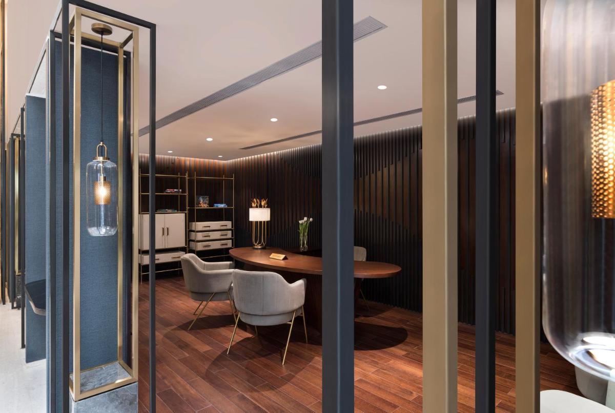 a kitchen and dining room with a table and chairs at InterContinental Jaipur Tonk Road by IHG in Jaipur