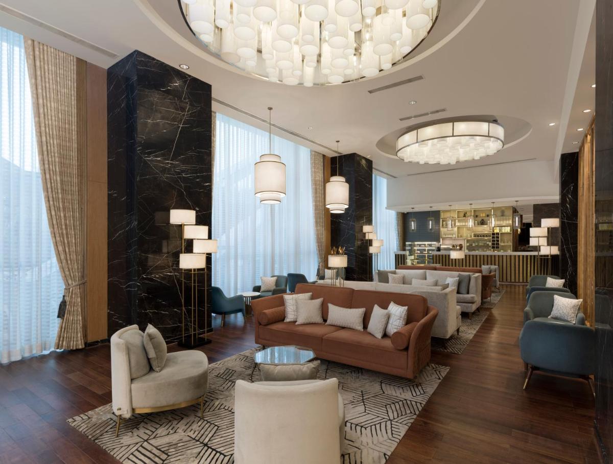 a living room with couches and chairs and a lobby at InterContinental Jaipur Tonk Road by IHG in Jaipur
