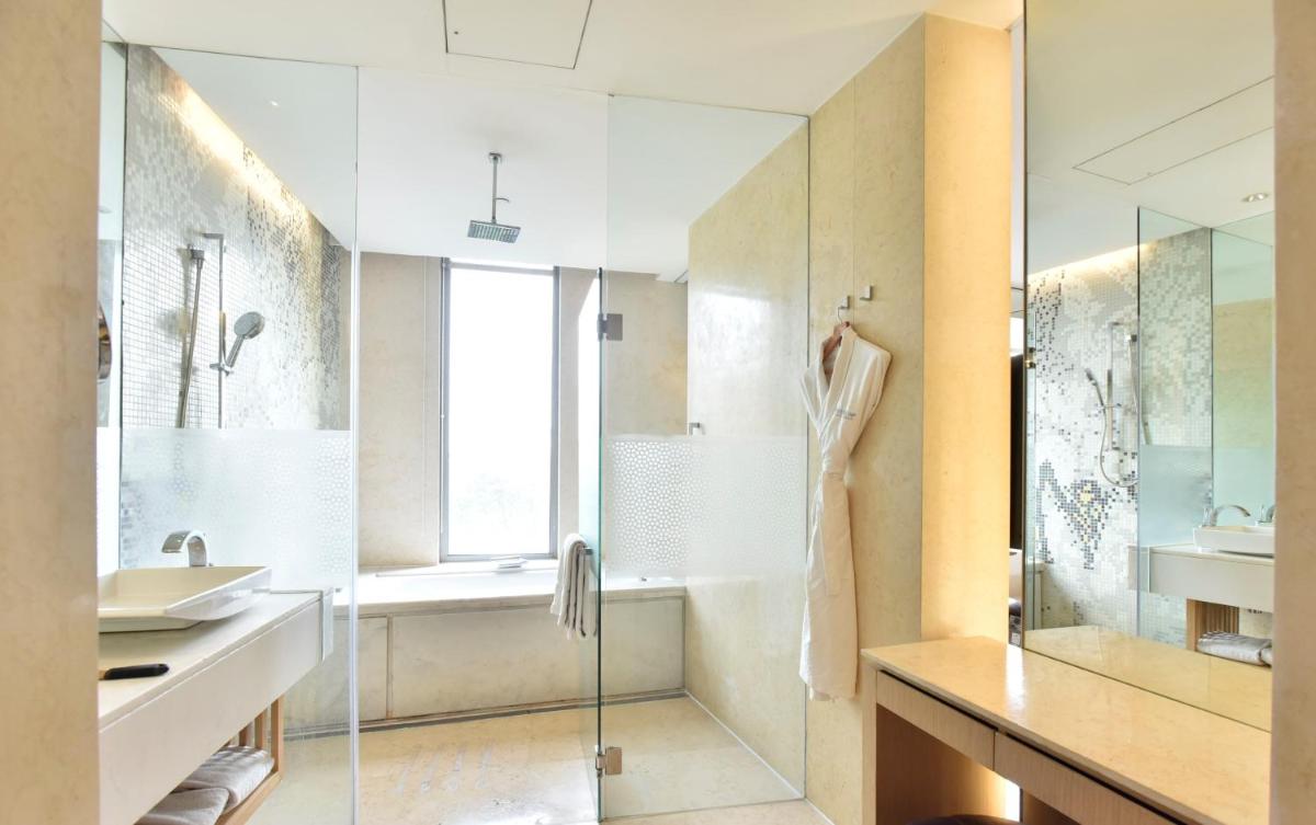 a bathroom with a shower and a sink at The Westin Gurgaon, New Delhi in Gurgaon