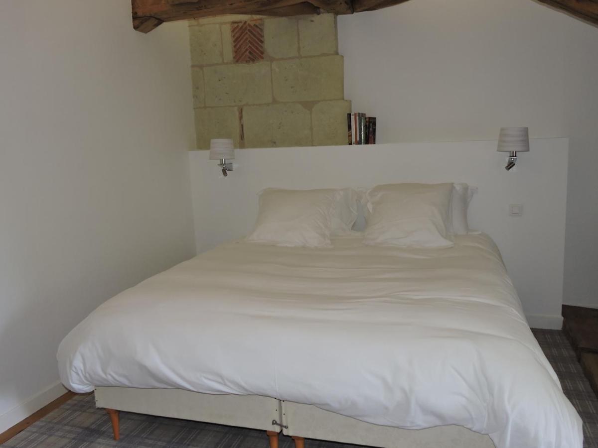 Un ou plusieurs lits dans un hébergement de l'établissement Le Domaine de Mestré, The Originals Relais