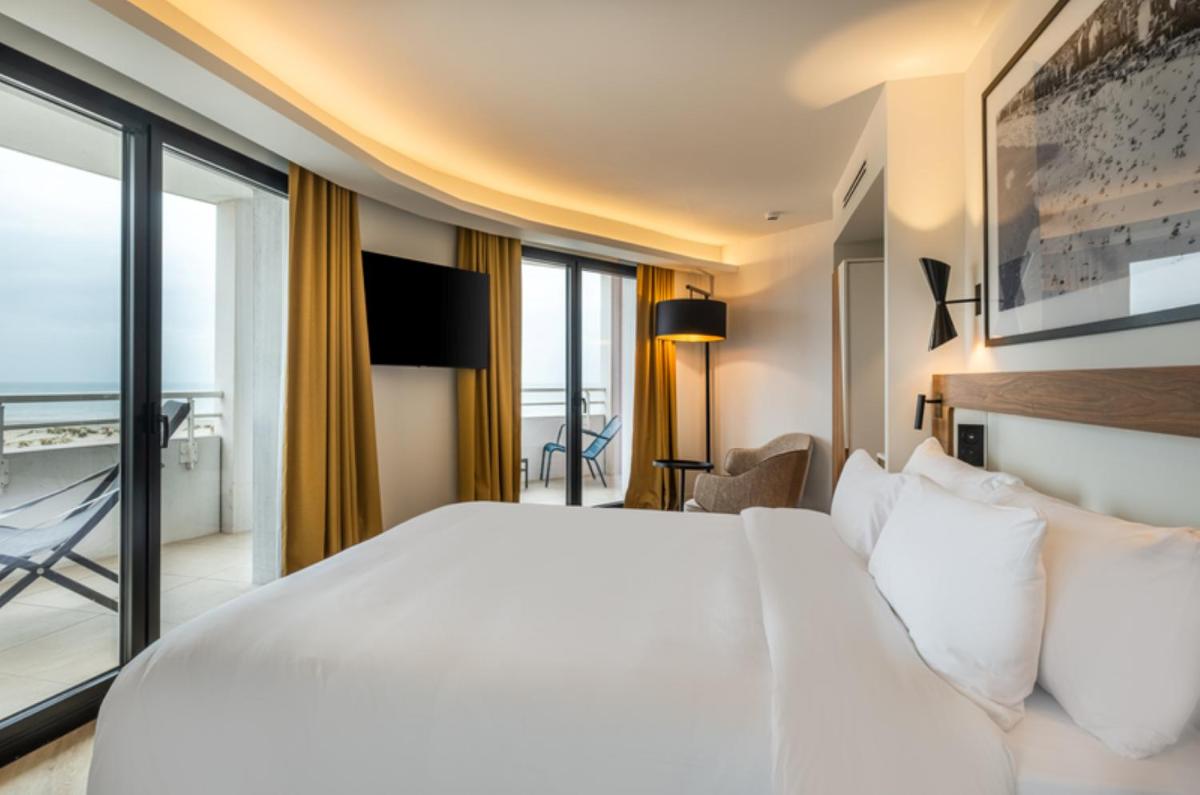Un ou plusieurs lits dans un hébergement de l'établissement Radisson Blu Grand Hotel & Spa, Malo-Les-Bains